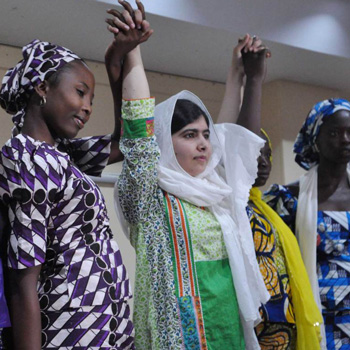 Malala holding hands with Kenyan girls